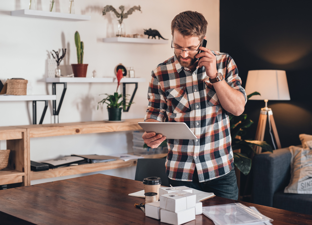 Self-emplayed man on the phone to client