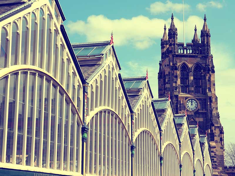 The Famous Old Market Hall and church tower. Vintage colors - instant filtered photo style in Stockport.